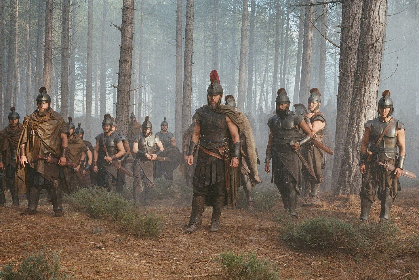 Various figures stand in the forest wearing armor.