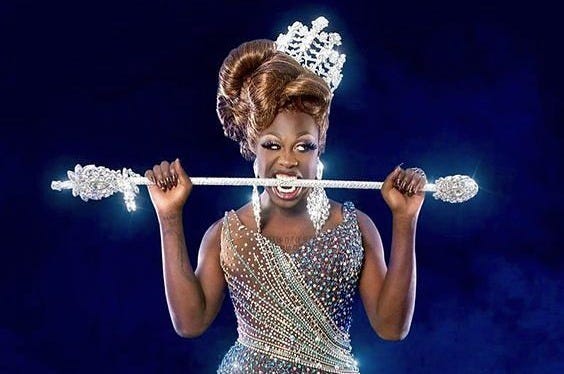 Bob the Drag Queen with her prize crown and sceptre