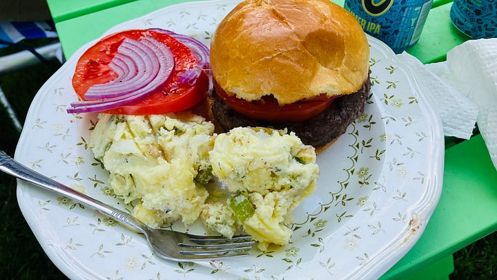 Grilling hamburgers, chicken, vegetables and peaches