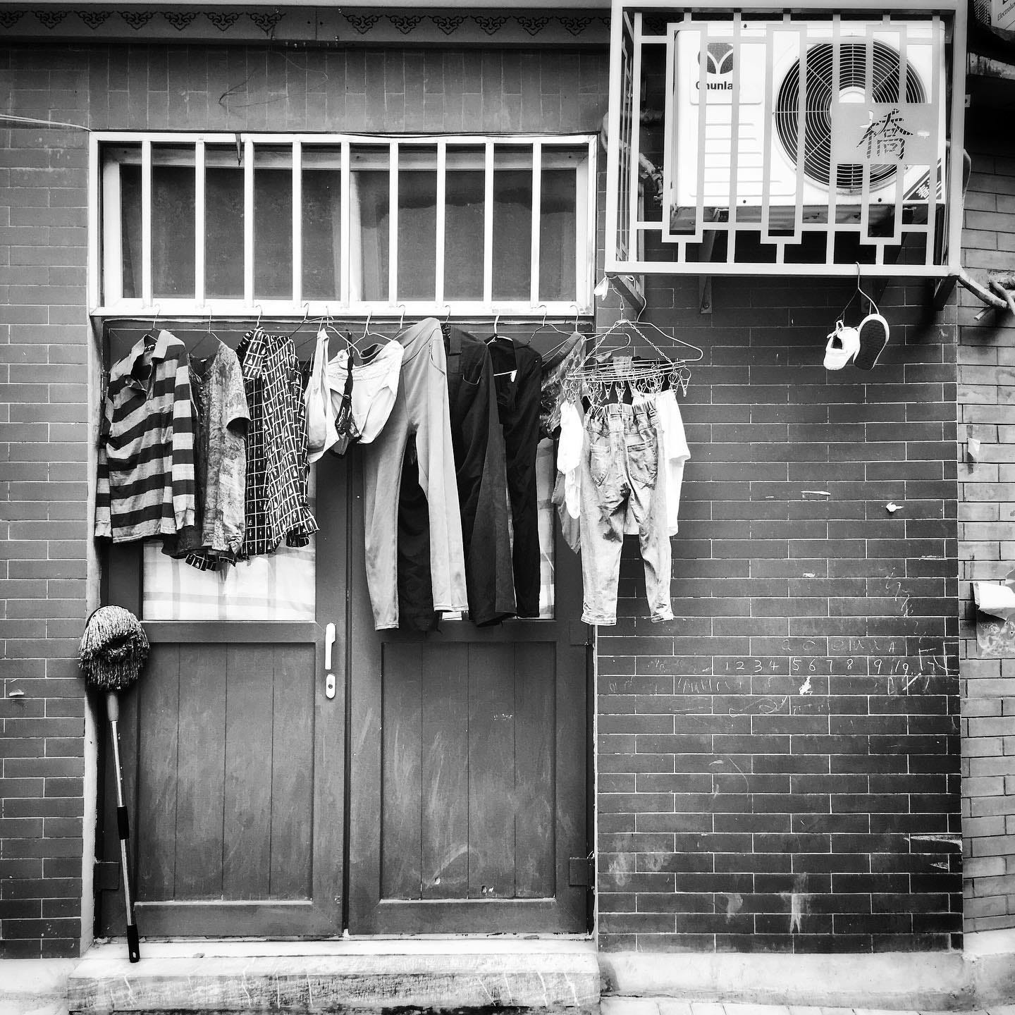 Clothes hanging out to dry in a Beijing hutong. Clothes hanging out to dry in a Beijing hutong.