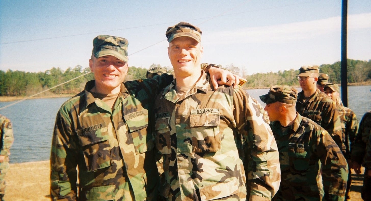 The Author posing for a Ranger School Graduation photo with arm around a friend.