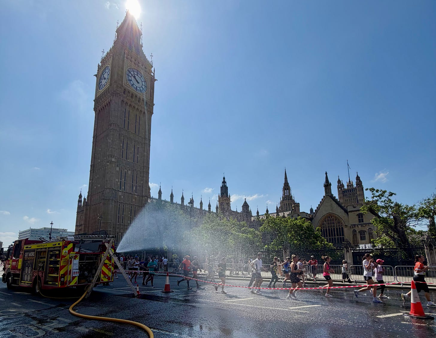 A fire engine keeps runners cool in the 2026 London 10K. A fire engine keeps runners cool in the 2026 London 10K.