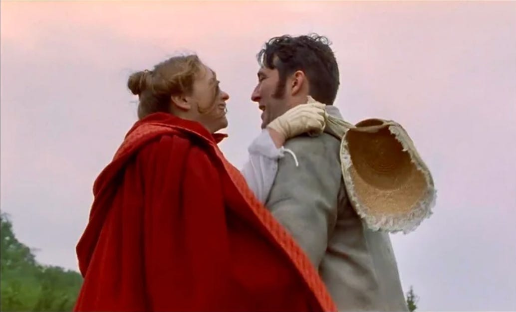 Man and woman embracing and laughing. 