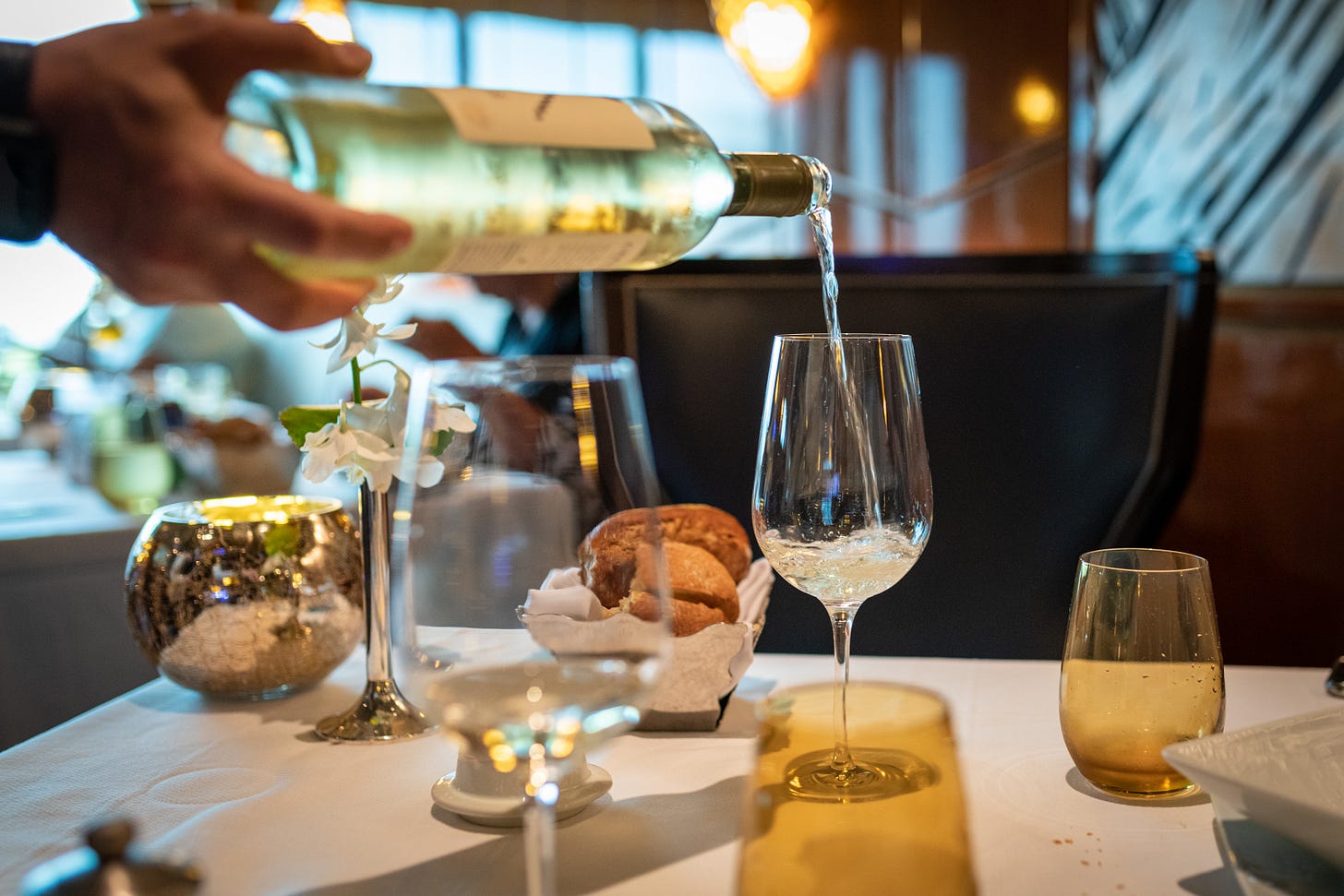 Wine bottle pouring on wine glass Wine bottle pouring on wine glass