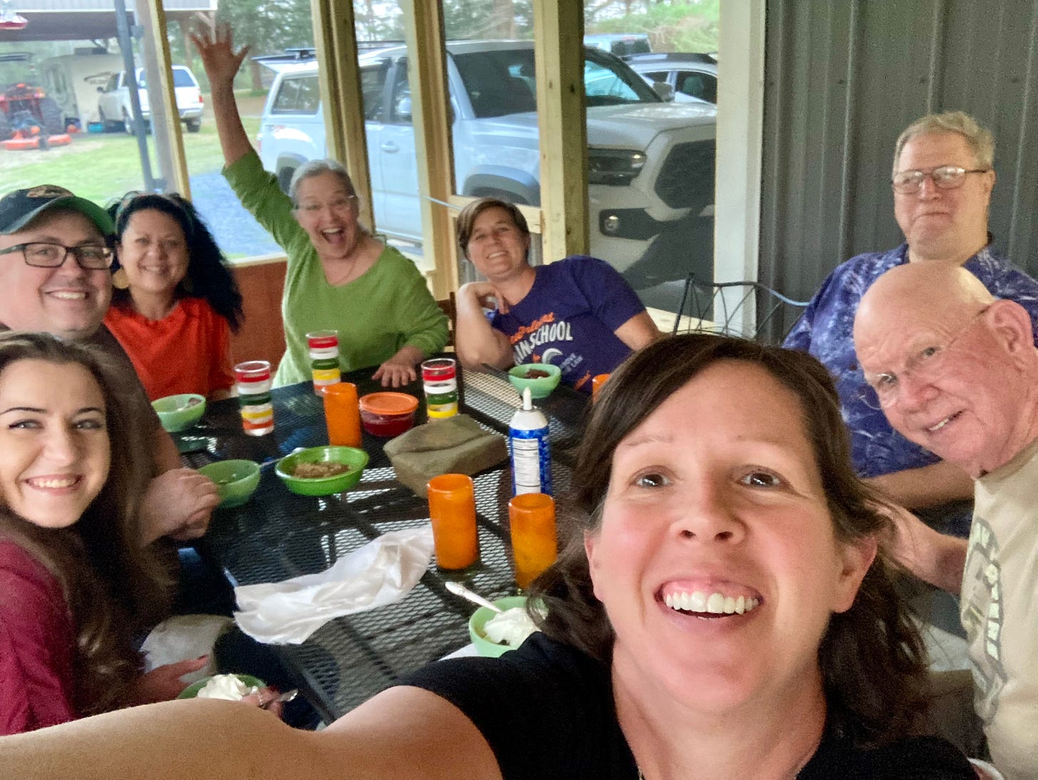 A group of friends seated around the dinner table.