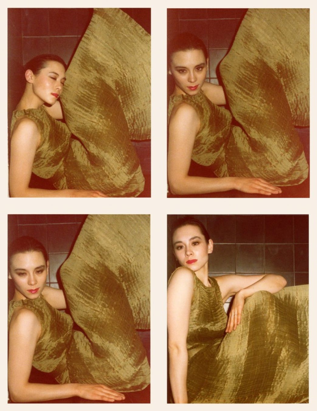 Four photographs depict a short-haired woman wearing a finely pleated jade green dress making various poses in a dark alcove.