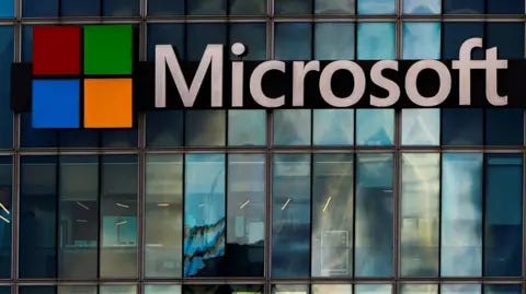 Reuters The Microsoft logo is lit up on a glass building in Paris