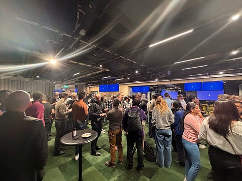 Participants networking, listening to talks, and discussing agents and data engineering during a community night at Google.