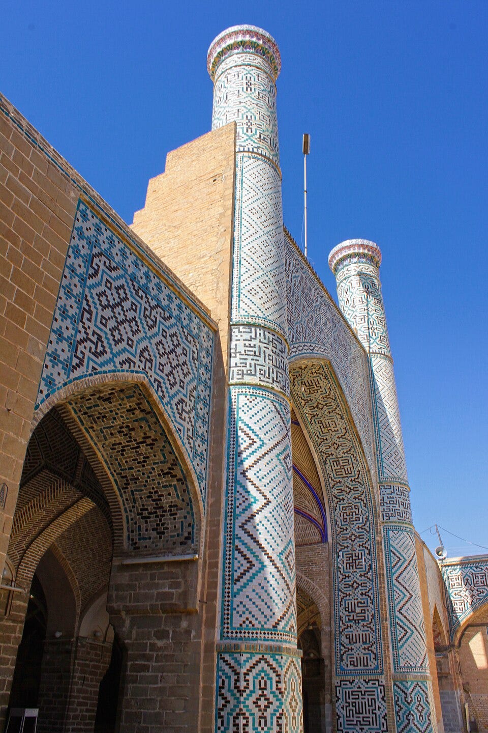 The tiled north-west iwan, with minarets The tiled north-west iwan, with minarets