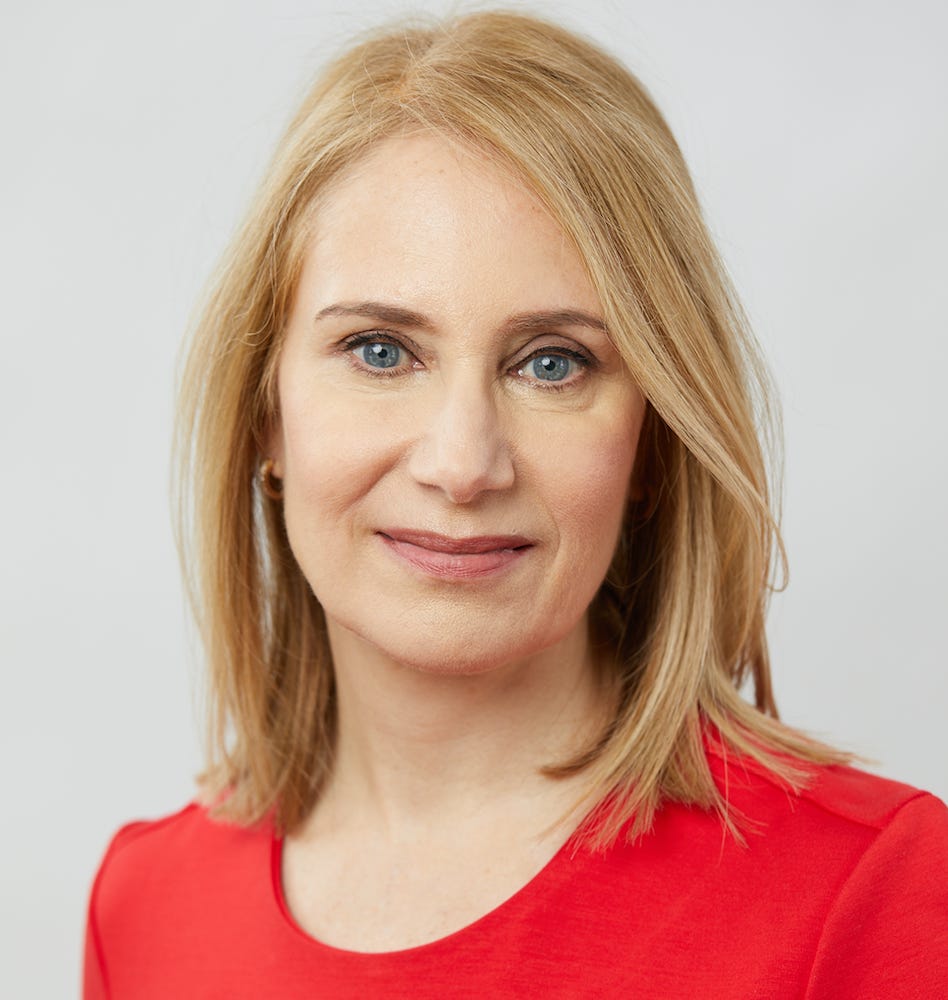A headshot of a woman with pale skin, shoulder length blonde hair and blue eyes, wearing a red dress A headshot of a woman with pale skin, shoulder length blonde hair and blue eyes, wearing a red dress