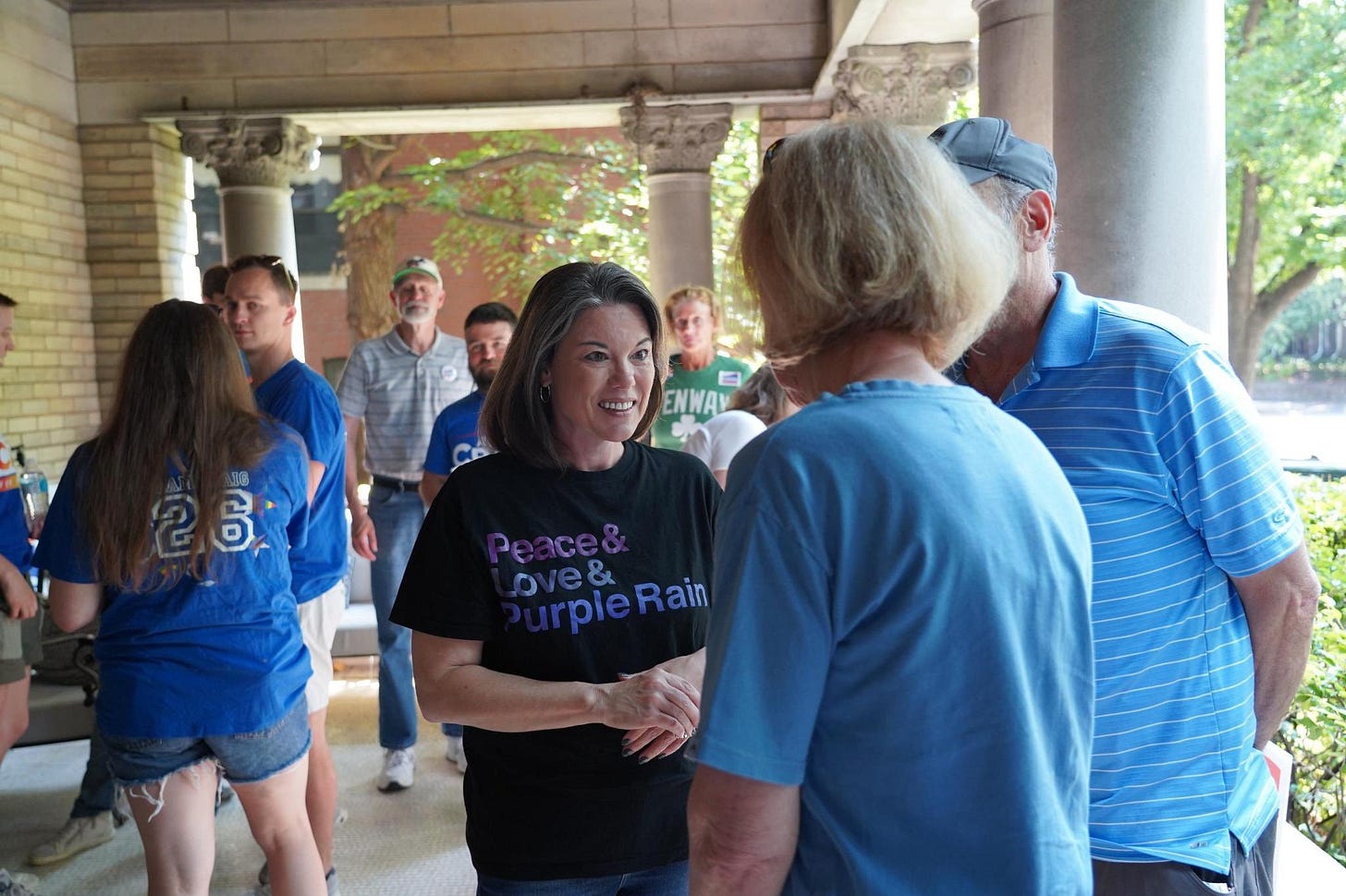 Angie Craig speaking with a group of supporters.