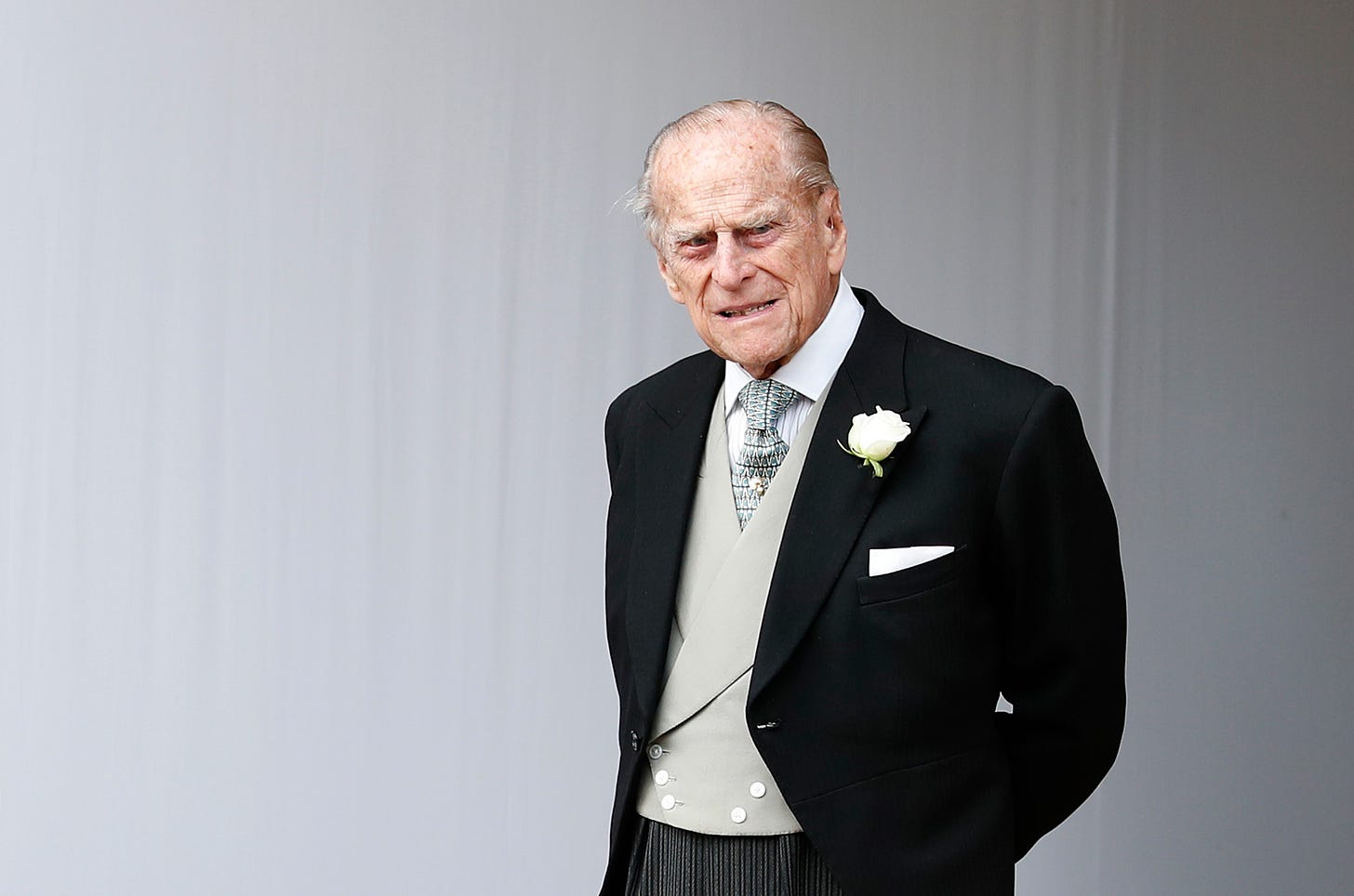 Prince Phillip in a black suit smiling