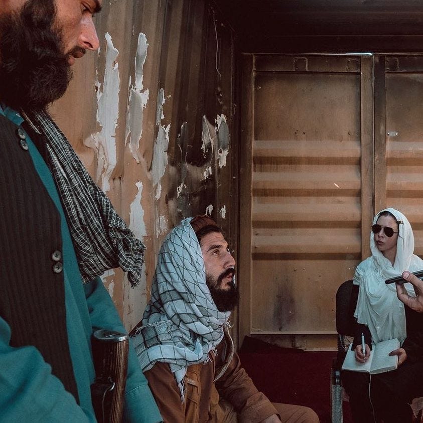 May be an image of 2 people, beard, people sitting and indoor