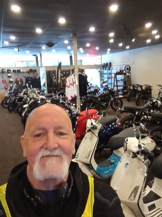 May be an image of motorcycle and scooter