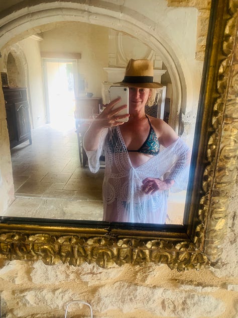 Two signs listing the dates of summer vacation closing times for businesses in France