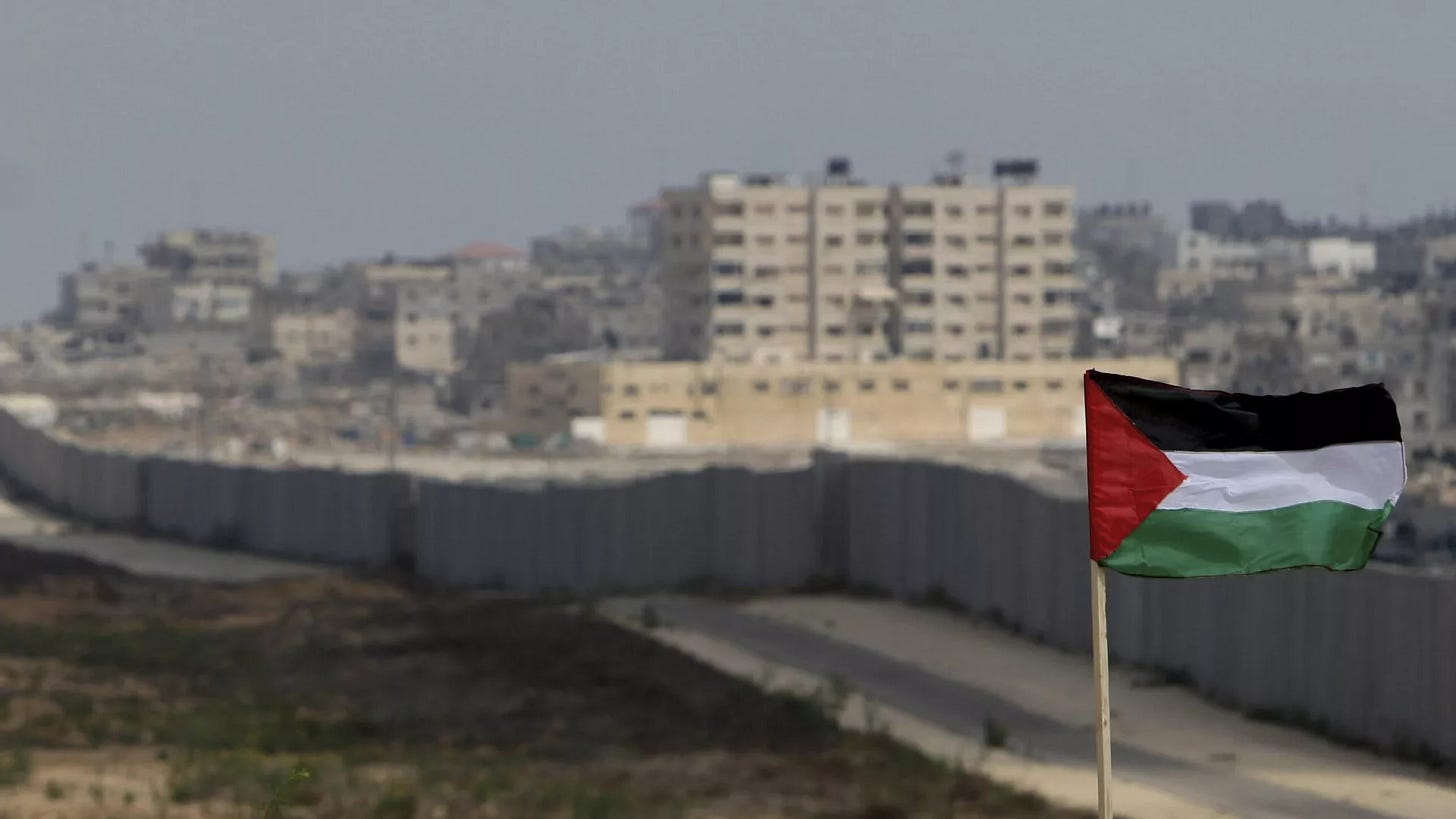 FILE - A Palestinian flag is seen with the background of a section of the wall in the Philadelphi corridor between Egypt and Gaza, on the background, near the southern Gaza Strip town of Rafah. - Sputnik International, 1920, 13.10.2024