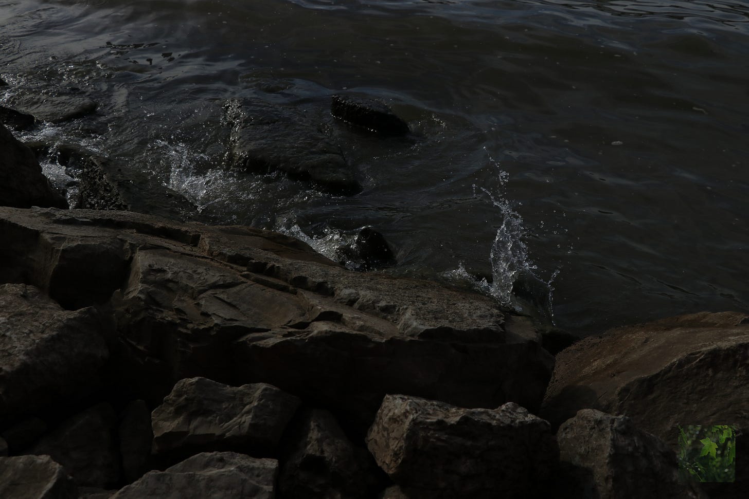 River splashing against boulders and rocks