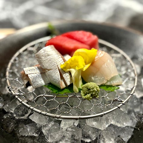 Pictures of the big fish market in Tokyo along with pieces of cut sushi.