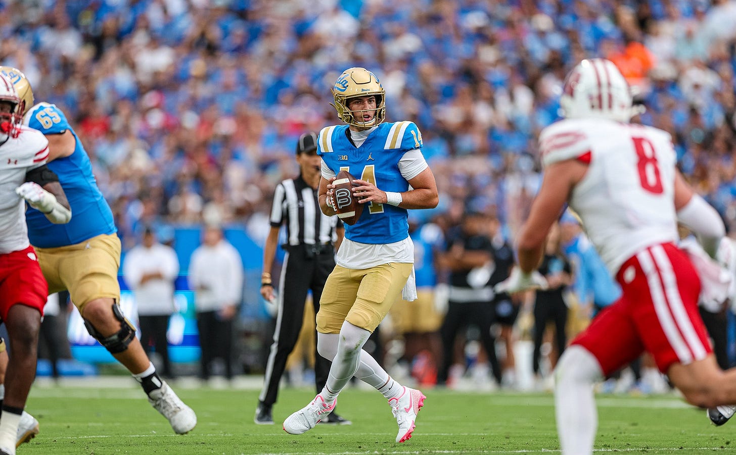 Wisconsin linebacker Mason Posa chases UCLA quarterback Ty Dieffenbach during a football game at the Rose Bowl. Wisconsin linebacker Mason Posa chases UCLA quarterback Ty Dieffenbach during a football game at the Rose Bowl.