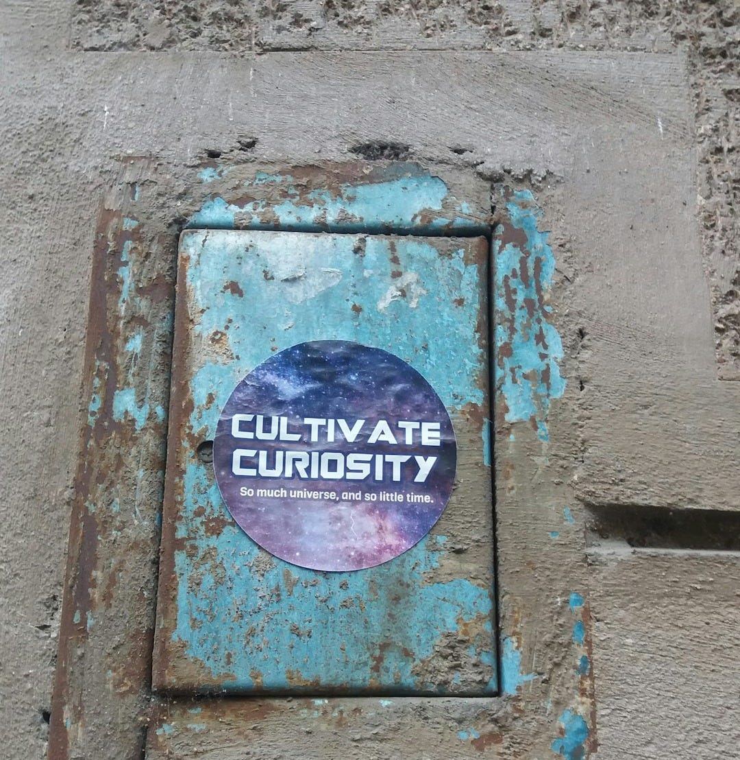a rusted out sign on the side of a building a rusted out sign on the side of a building
