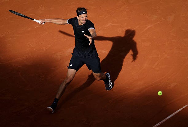 Germany's Alexander Zverev plays a forehand return to Italy's Flavio Cobolli during their men's final singles match on day 15 of the French Open...