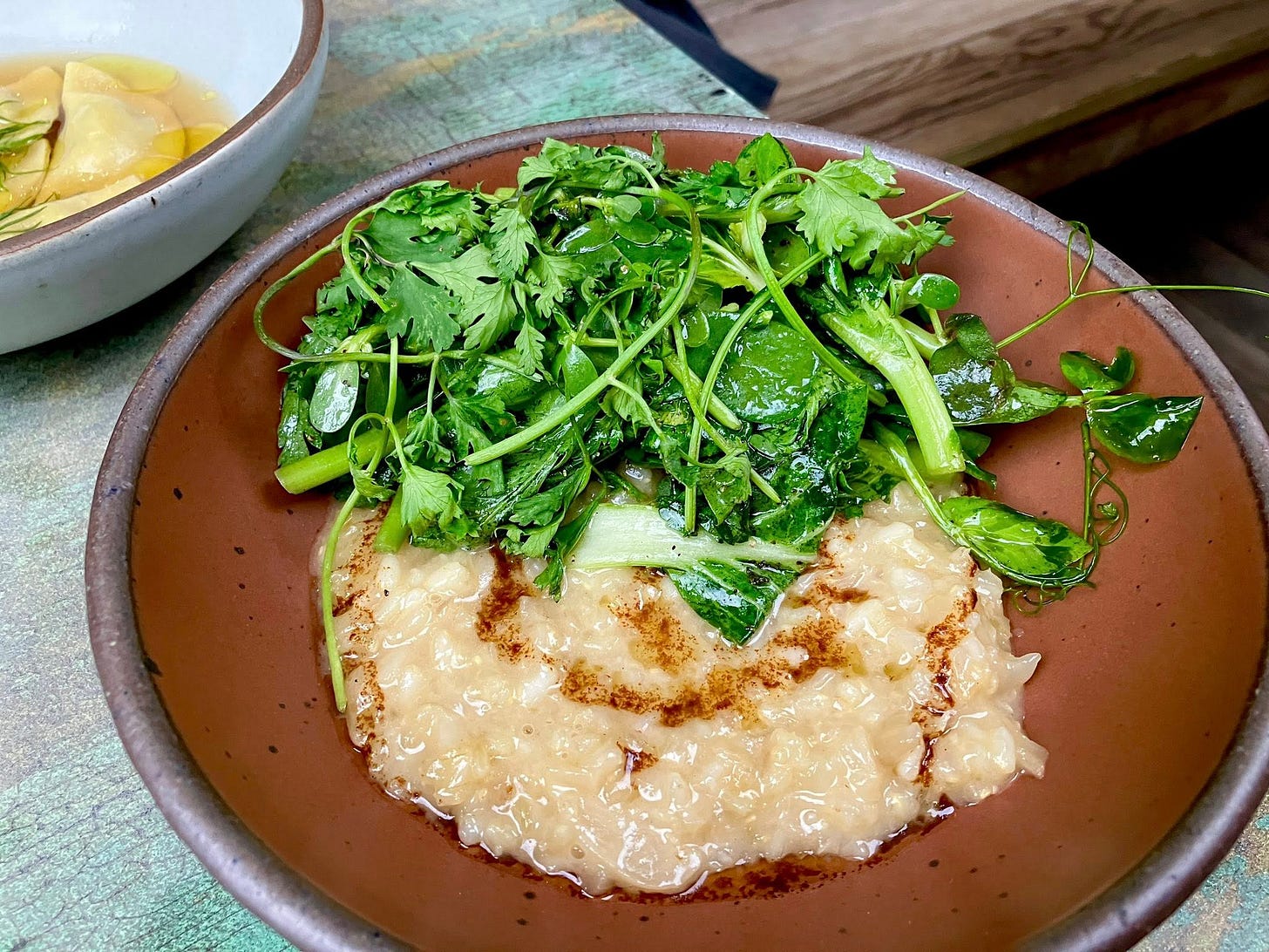 May be an image of congee and poached egg