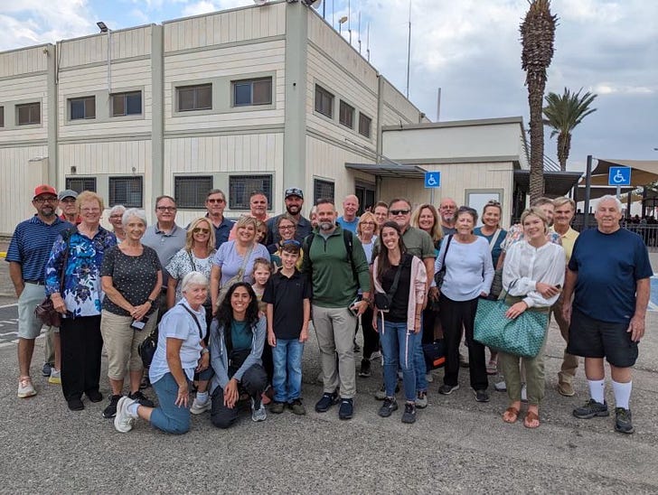 Mills with the Americans he rescued in Israel