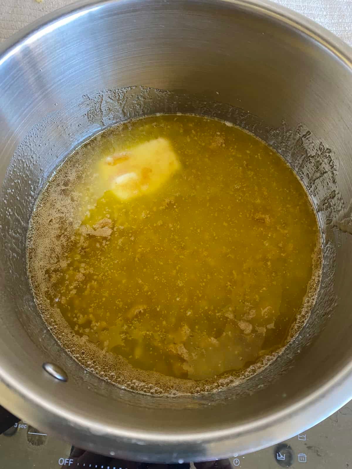 Butter and Sugar melting in a pan. Butter and Sugar melting in a pan.