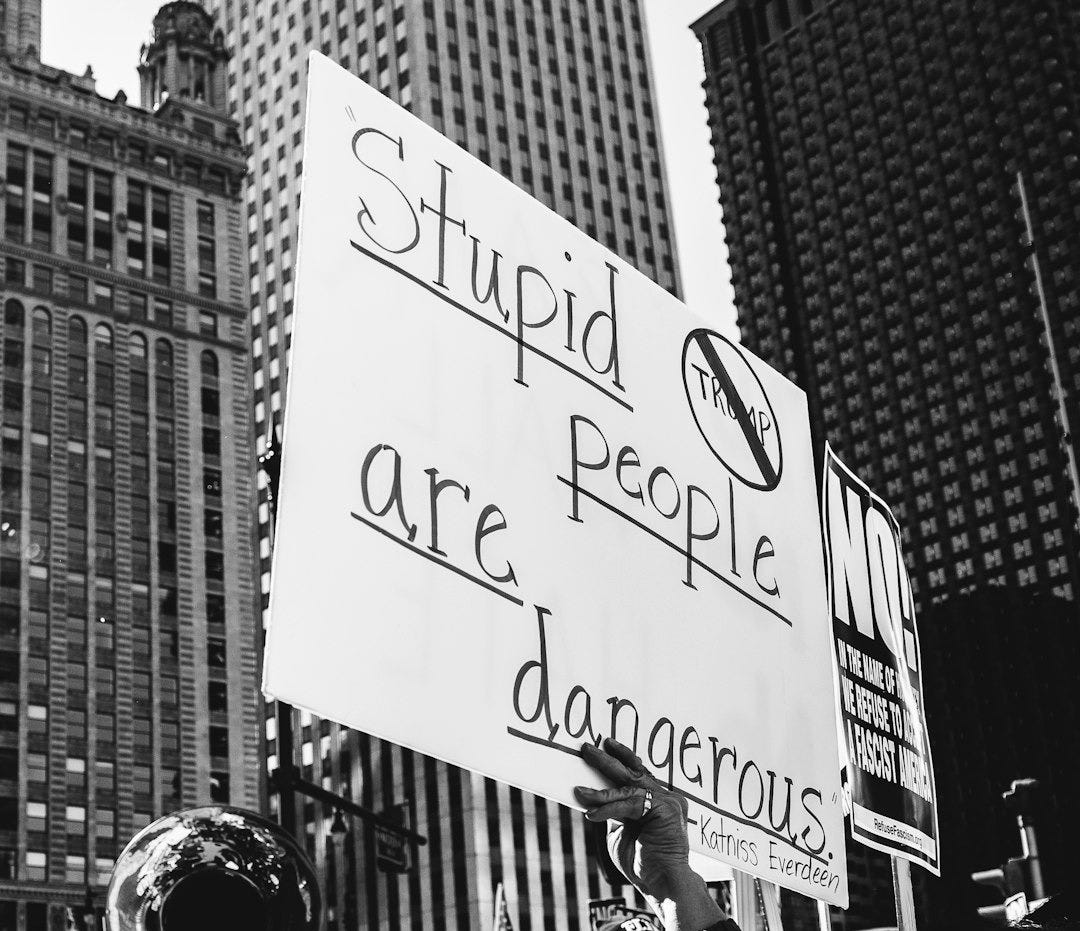 grayscale photo of people in street