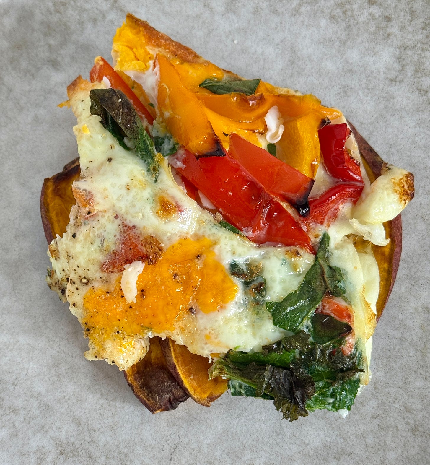 Sweet potato toast topped with veggie frittata
