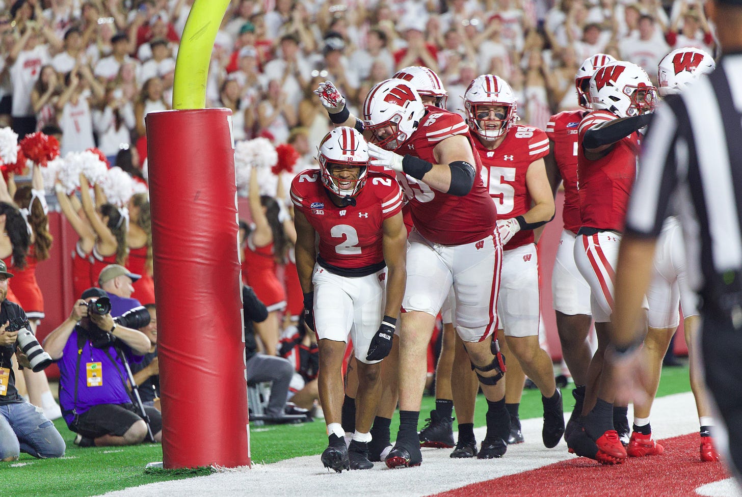 Wisconsin Badgers players celebrate with Chris Brooks Jr. after his touchdown at Camp Randall Stadium. Wisconsin Badgers players celebrate with Chris Brooks Jr. after his touchdown at Camp Randall Stadium.