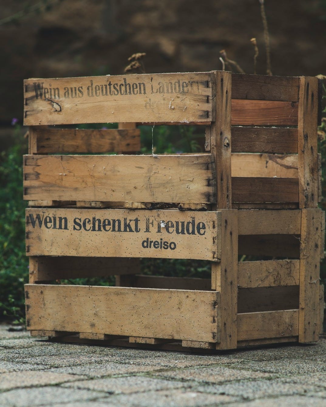 brown wooden crate on gray concrete floor