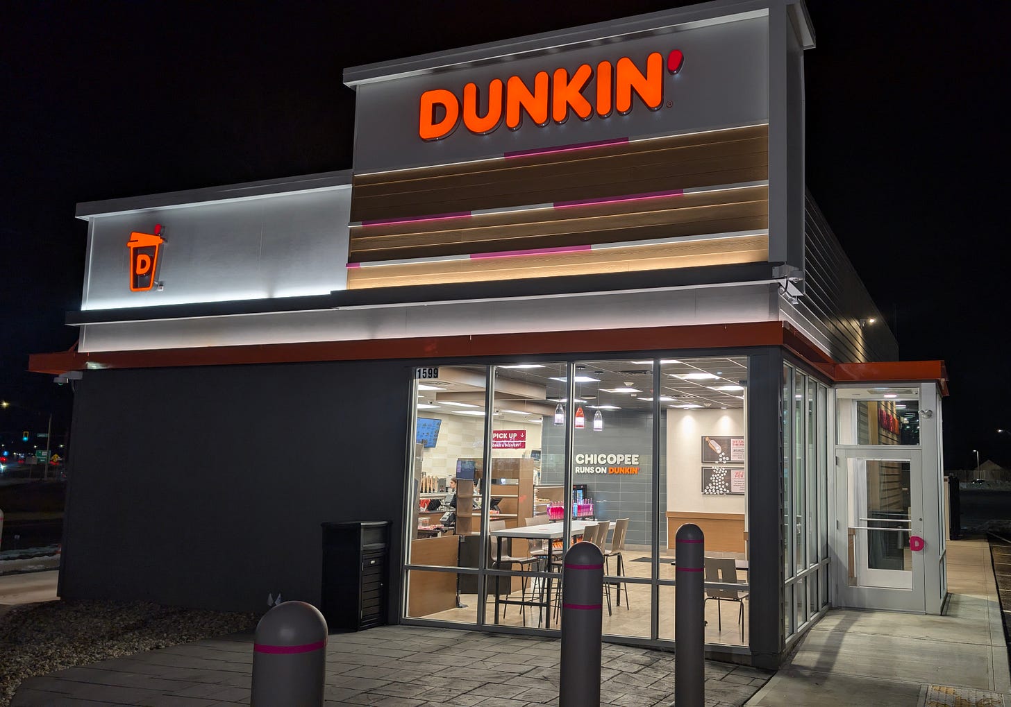 A Dunkin' storefront at night