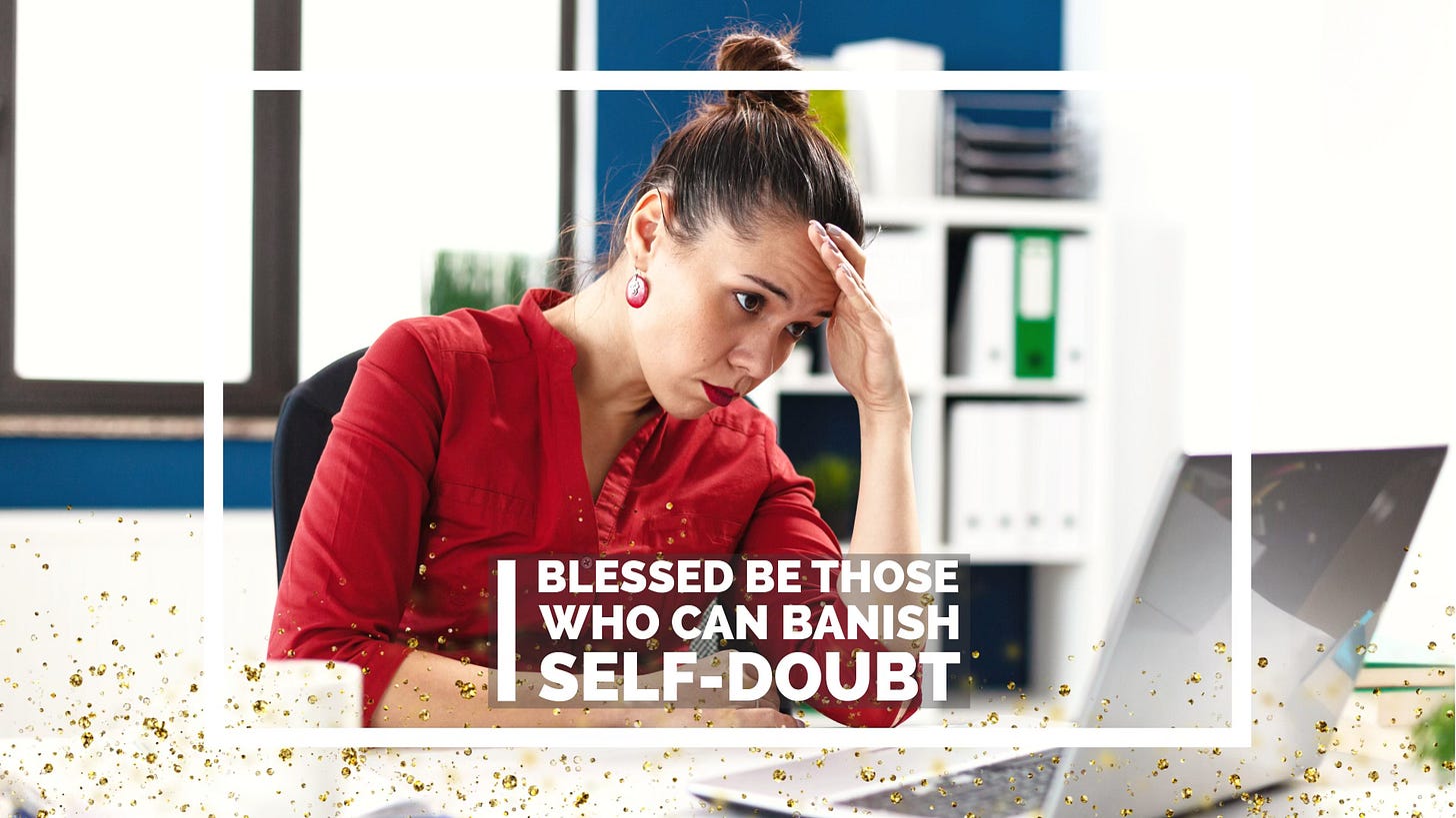Woman sitting looking at a laptop looking concerned, resting her head on her hand