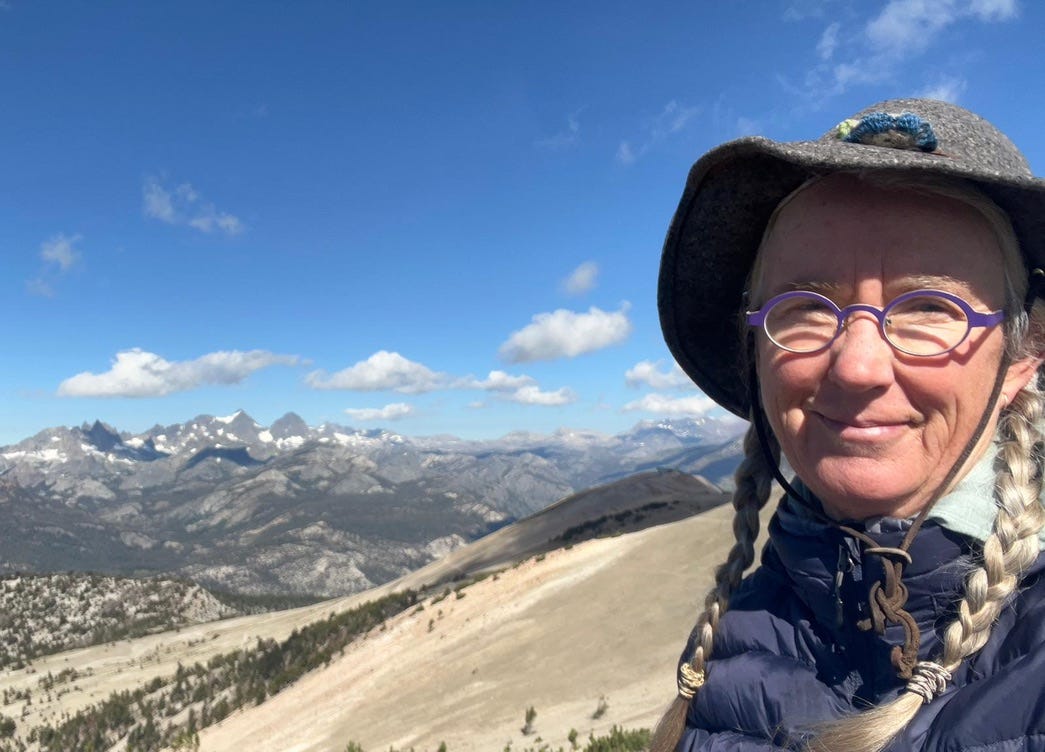 woman with mountains in the background