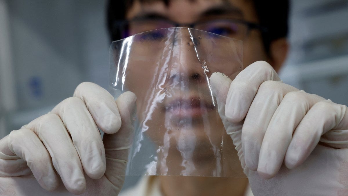 A researcher shows a sample of ocean-degradable plastic at the Center for Emergent Matter Science (CEMS) of the Japanese research institution Riken, Wako, Saitama Prefecture, Japan, May 27, 2025. (Reuters Photo)