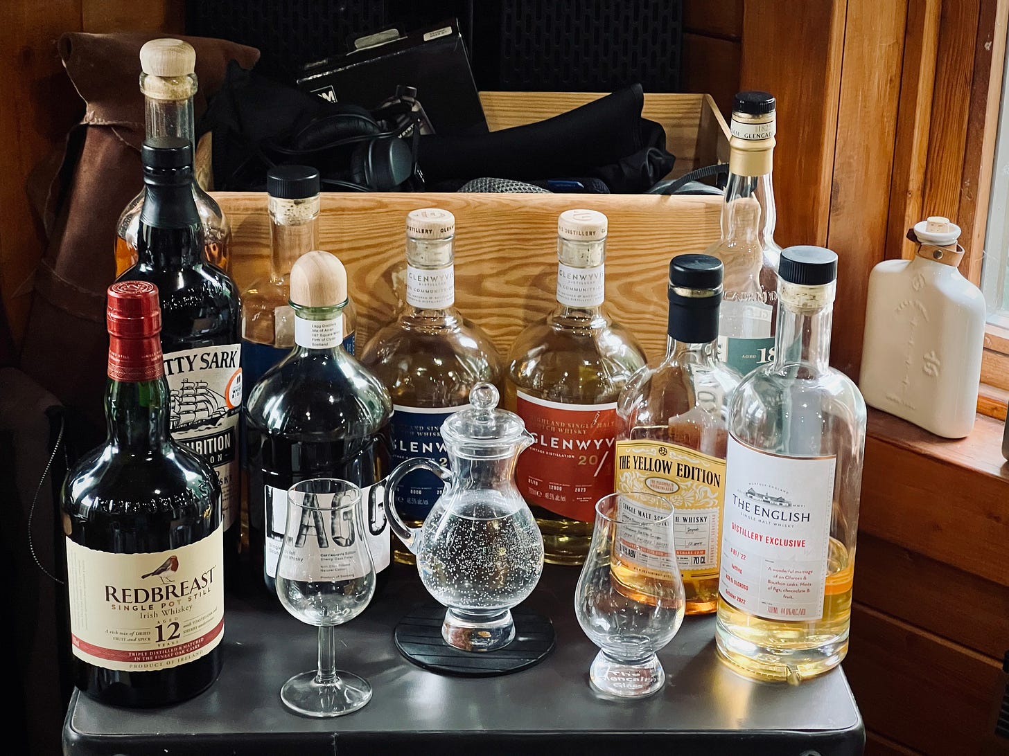 Ten bottles of whisky lined up in the corner of my shed