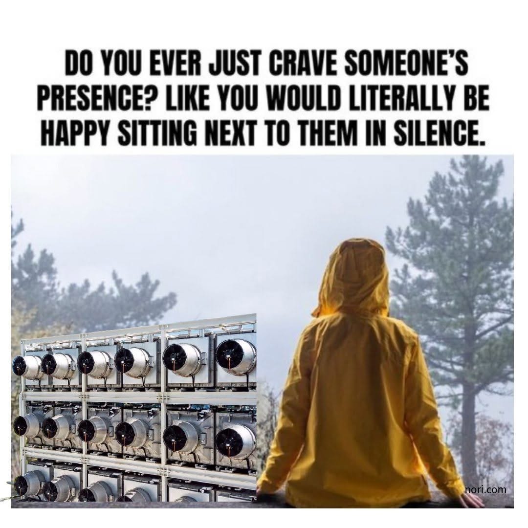A person in a yellow raincoat sitting beside a stack of direct air capture fans, under the text "Do you ever just crave someone's presence? Like you would literally be happy sitting next to them in silence."