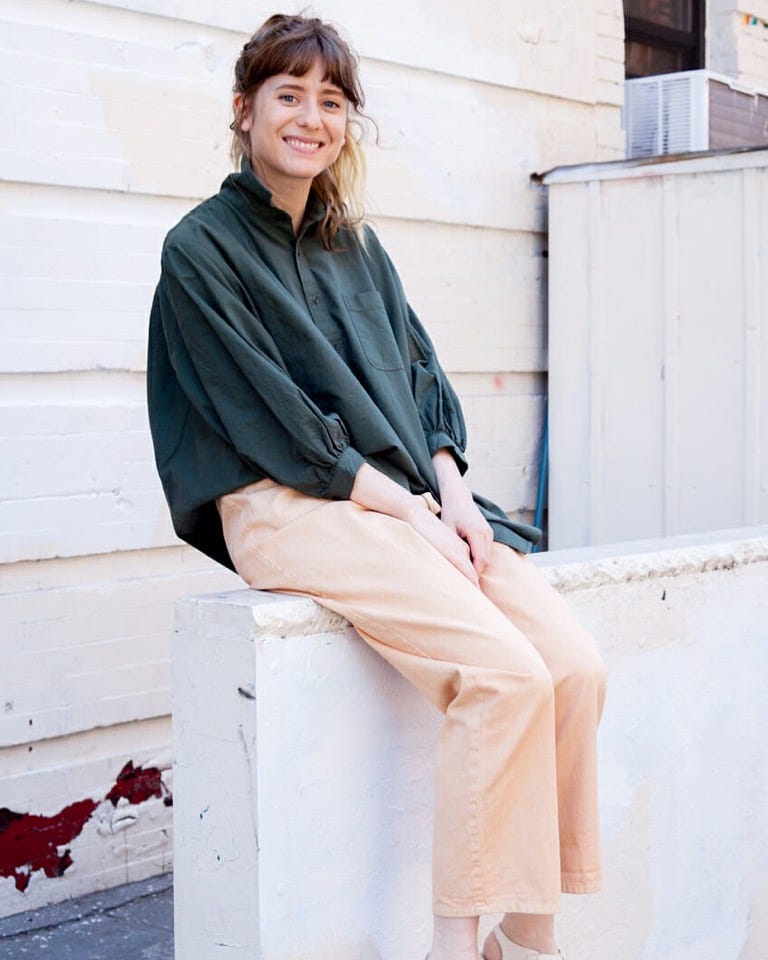 Haley Nahman sitting outside