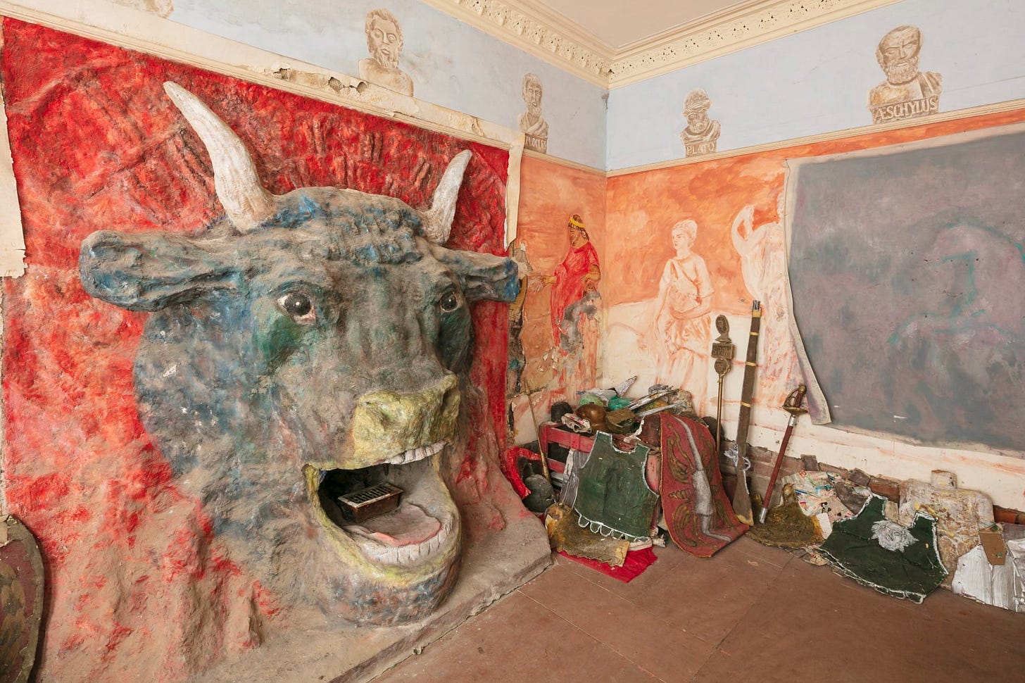 the interior of Ron Gittins' apartment in Birkenhead, England, featuring a very ornate, hand-sculpted fireplace of a bull's head with murals all around on the walls the interior of Ron Gittins' apartment in Birkenhead, England, featuring a very ornate, hand-sculpted fireplace of a bull's head with murals all around on the walls