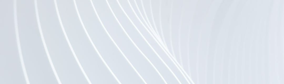 a close up of a white wall with wavy lines a close up of a white wall with wavy lines