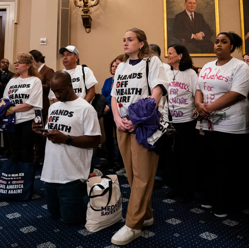 Half a dozen protesters wearing shirt that read 'hands off our health care' stand in the back of a committee chamber on capitol hill.