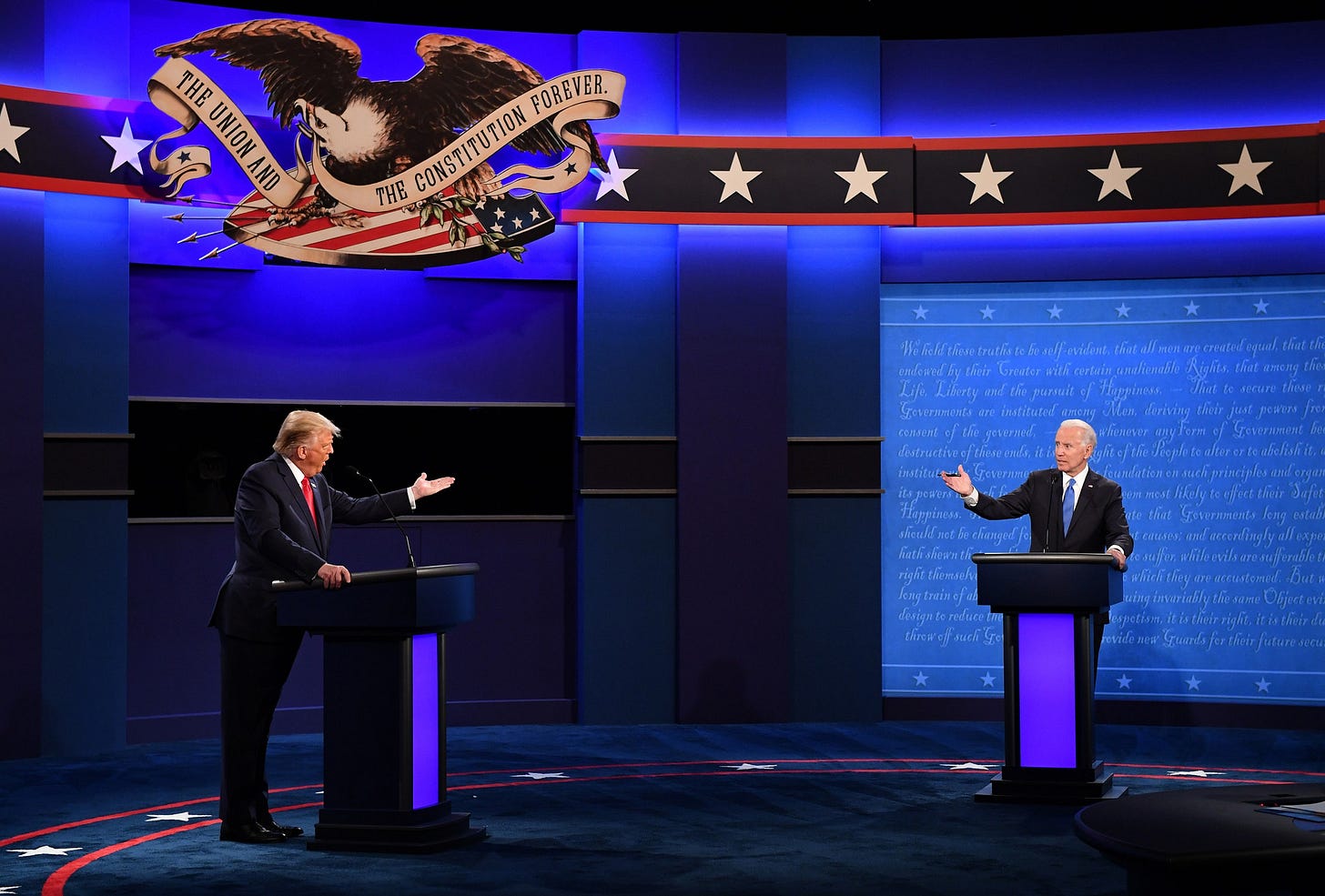 Donald Trump and Joseph Biden on a debate stage. Donald Trump and Joseph Biden on a debate stage.