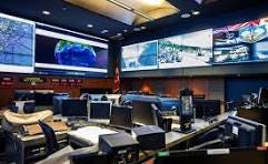 A room with computers and monitors
AI-generated content may be incorrect. A room with computers and monitors
AI-generated content may be incorrect.