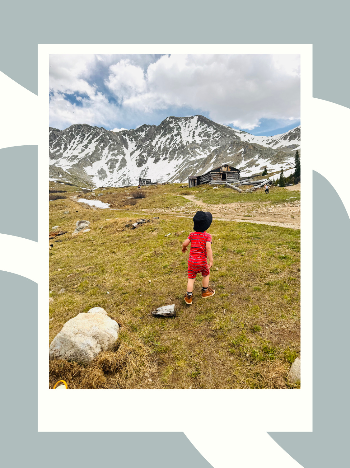 child hiking in the mountains