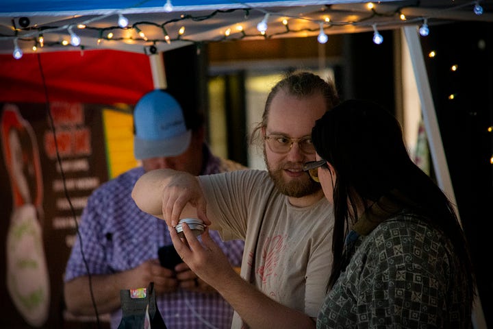 Vendors and red brick and pretty lights at The Moon Market