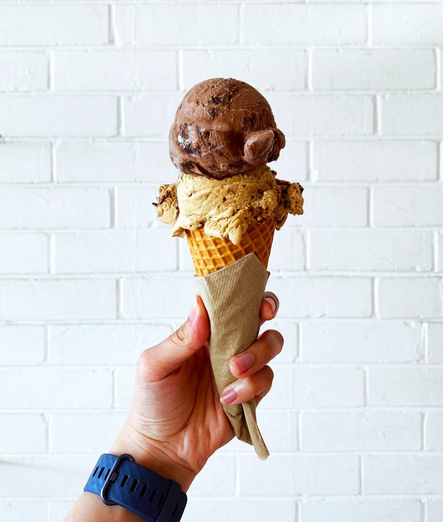 person holding ice cream cone