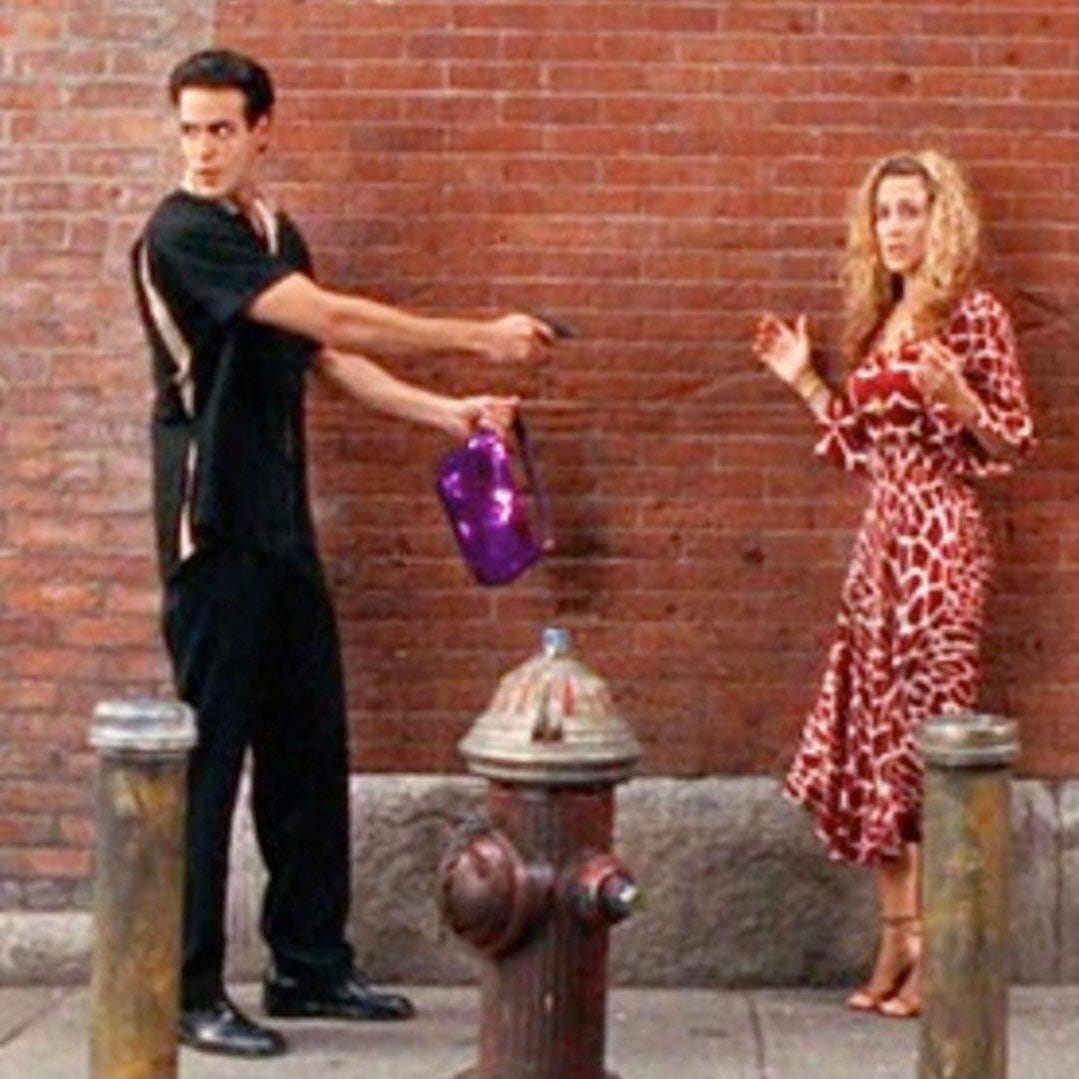 Nathan on X: "“it's a baguette!” carrie bradshaw getting mugged and giving  away her fendi “baguette” bag in this now-iconic moment from 'sex and the  city', while wearing a red version of