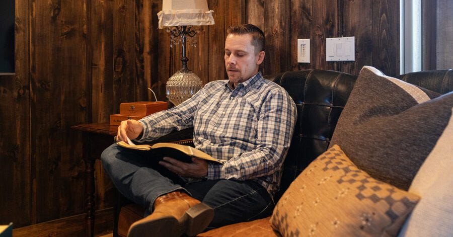 A homeschool father reading the Bible to help him raise mission-minded children A homeschool father reading the Bible to help him raise mission-minded children