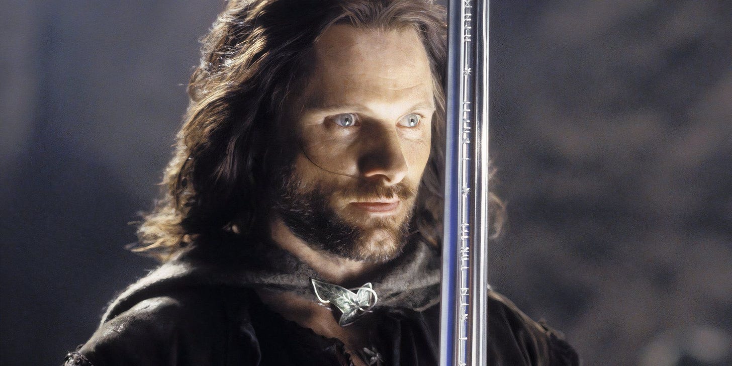 Viggo Mortensen as Aragorn in The Lord of the Rings holding his sword, Narsil.